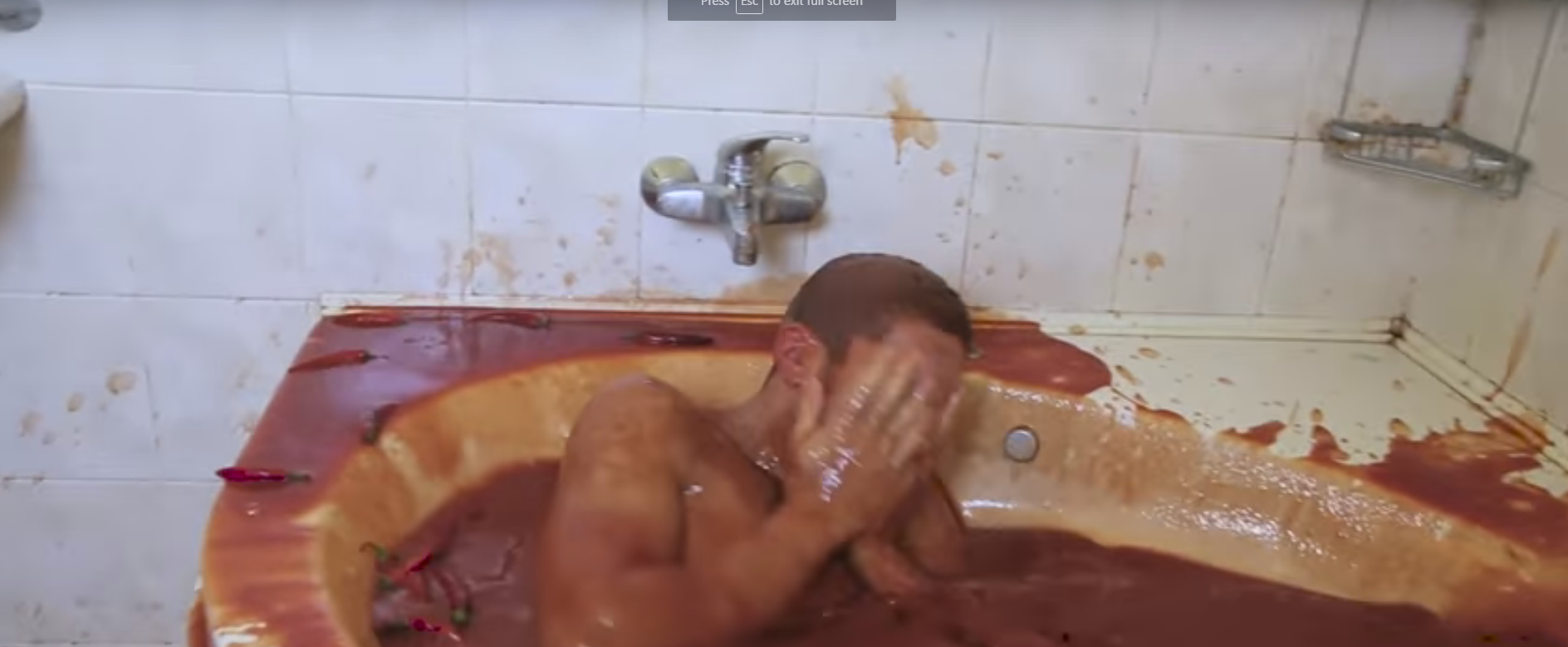 Watch This Stupid Idiot Jump in a Bathtub Full of Hot Sauce