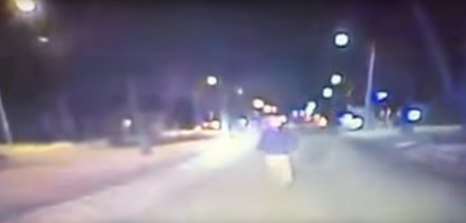 Drunk Man Gloriously Celebrates New Years Eve by Belly Flopping on a Police Car [VIDEO]