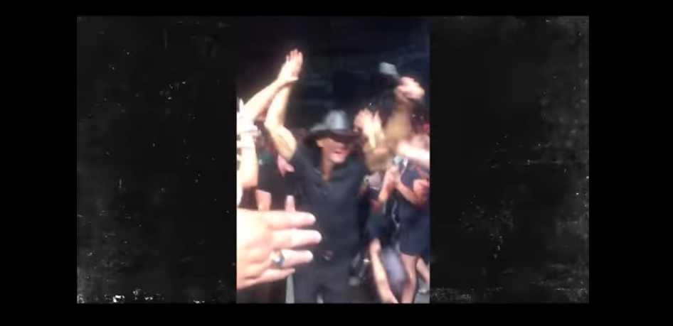 Watch Tim McGraw Accidentally Run Into a Fan While Sprinting Towards the Stage