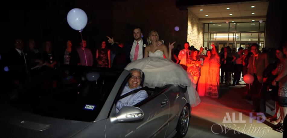 Newlywed Couple Falls Off the Back of Convertible After Wedding [VIDEO]
