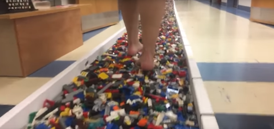 Virginia Resident Breaks Guinness Book of World Record by Walking Over 120 Feet of Lego Bricks OUCH