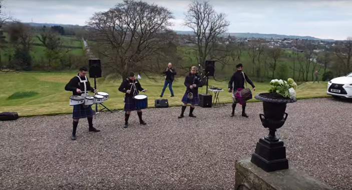 Hilarious Child Does the Floss Dance Next to a Guy Playing the Bagpipes [WATCH]